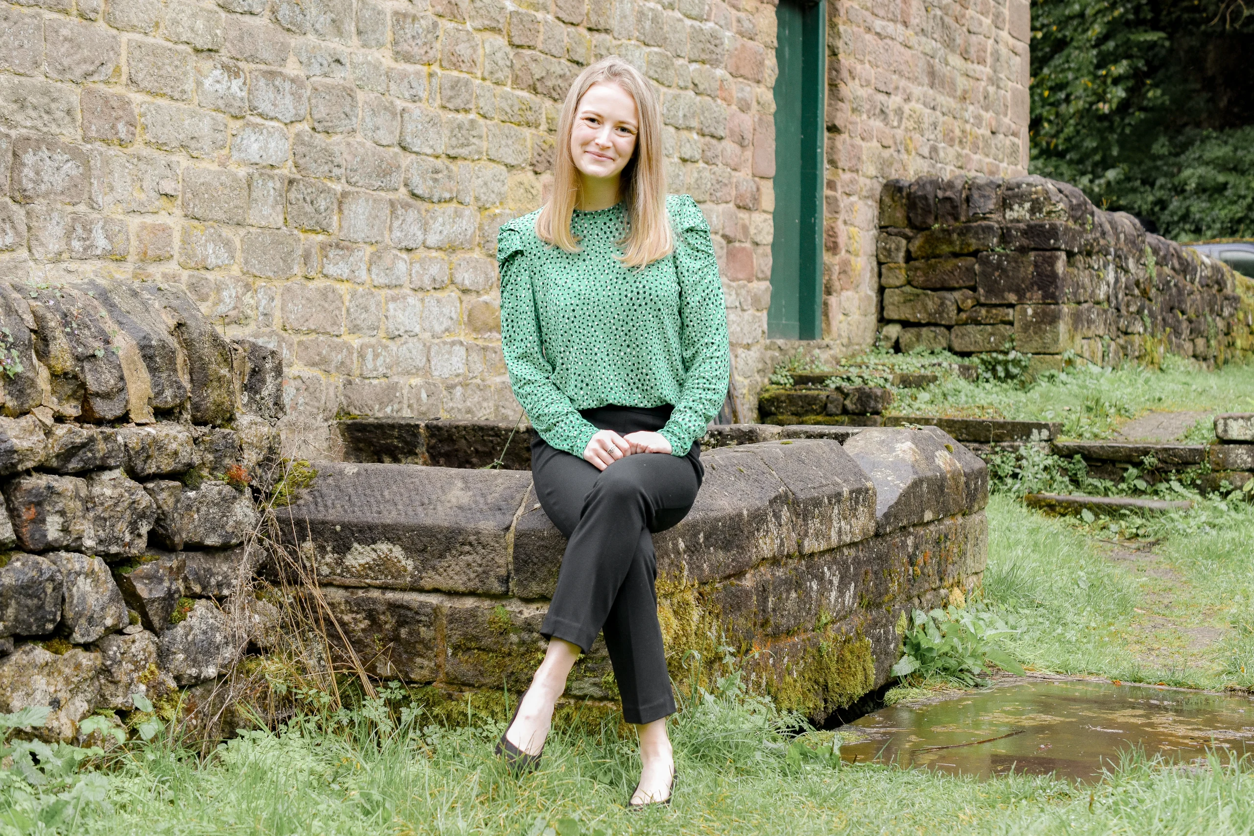 Maya, eco Virtual Assistant, sitting outside