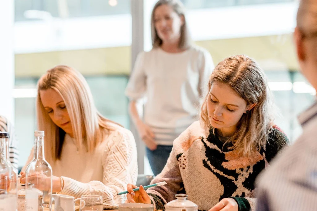 Maya sitting at a desk working as a Virtual Assistant