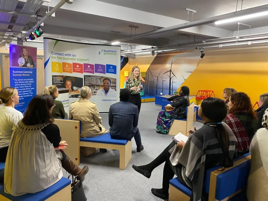 Founder Maya delivering a talk about her journey growing an ethical Virtual Assistant business